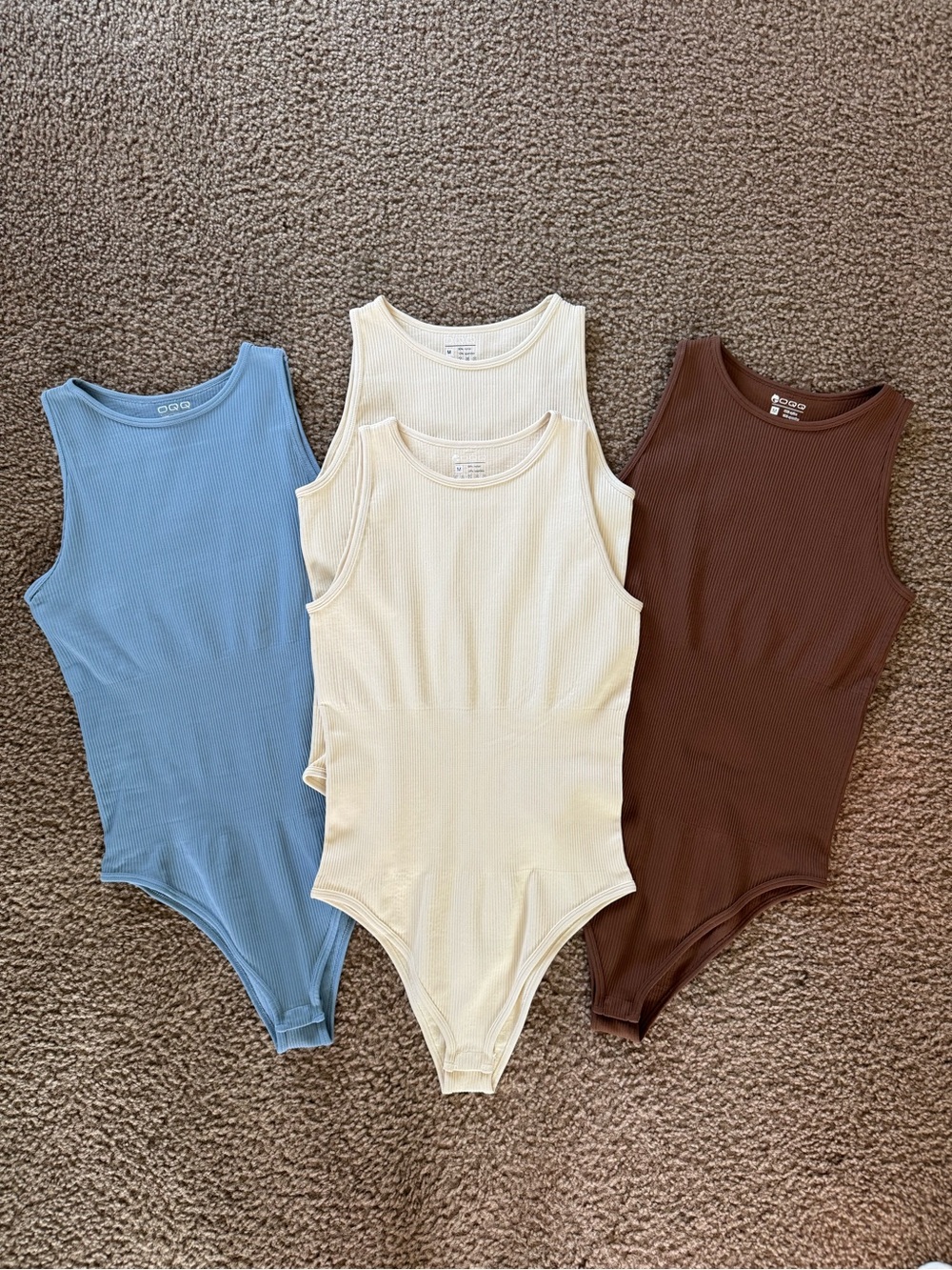 NWOT OQQ Women's 4 Piece Bodysuits Set Size M